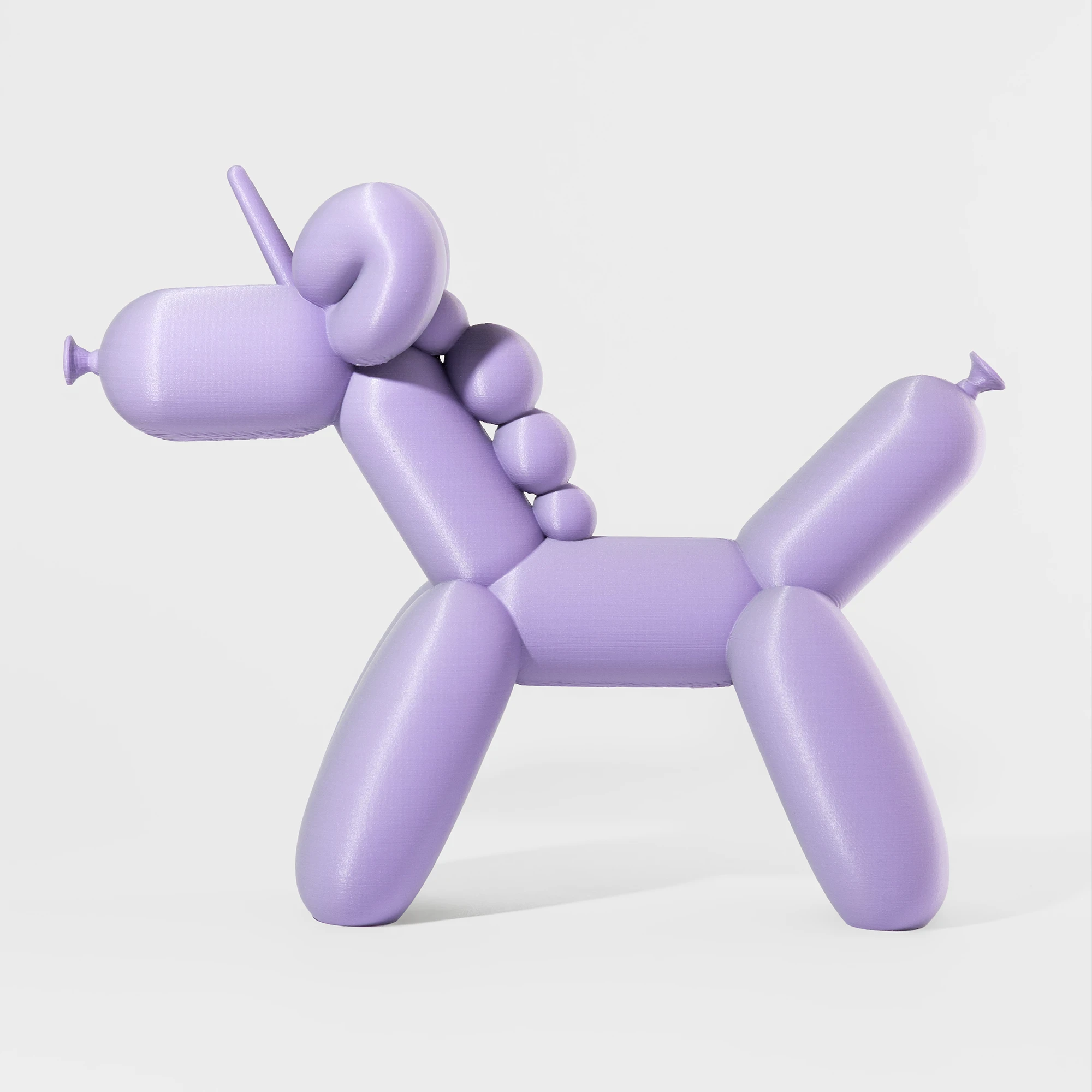 הדפסת תלת מימד של בלון בצורת חד קרן בגווני סגול ואפור