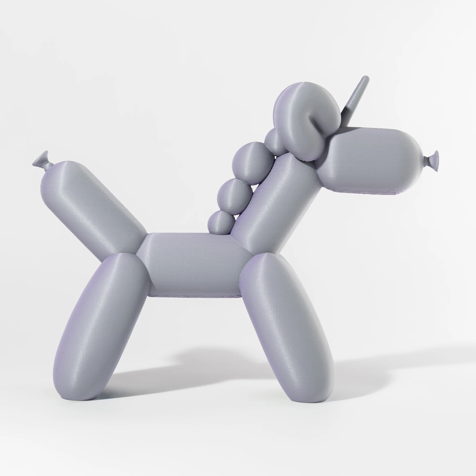 הדפסת תלת מימד של בלון בצורת חד קרן בגווני סגול ואפור