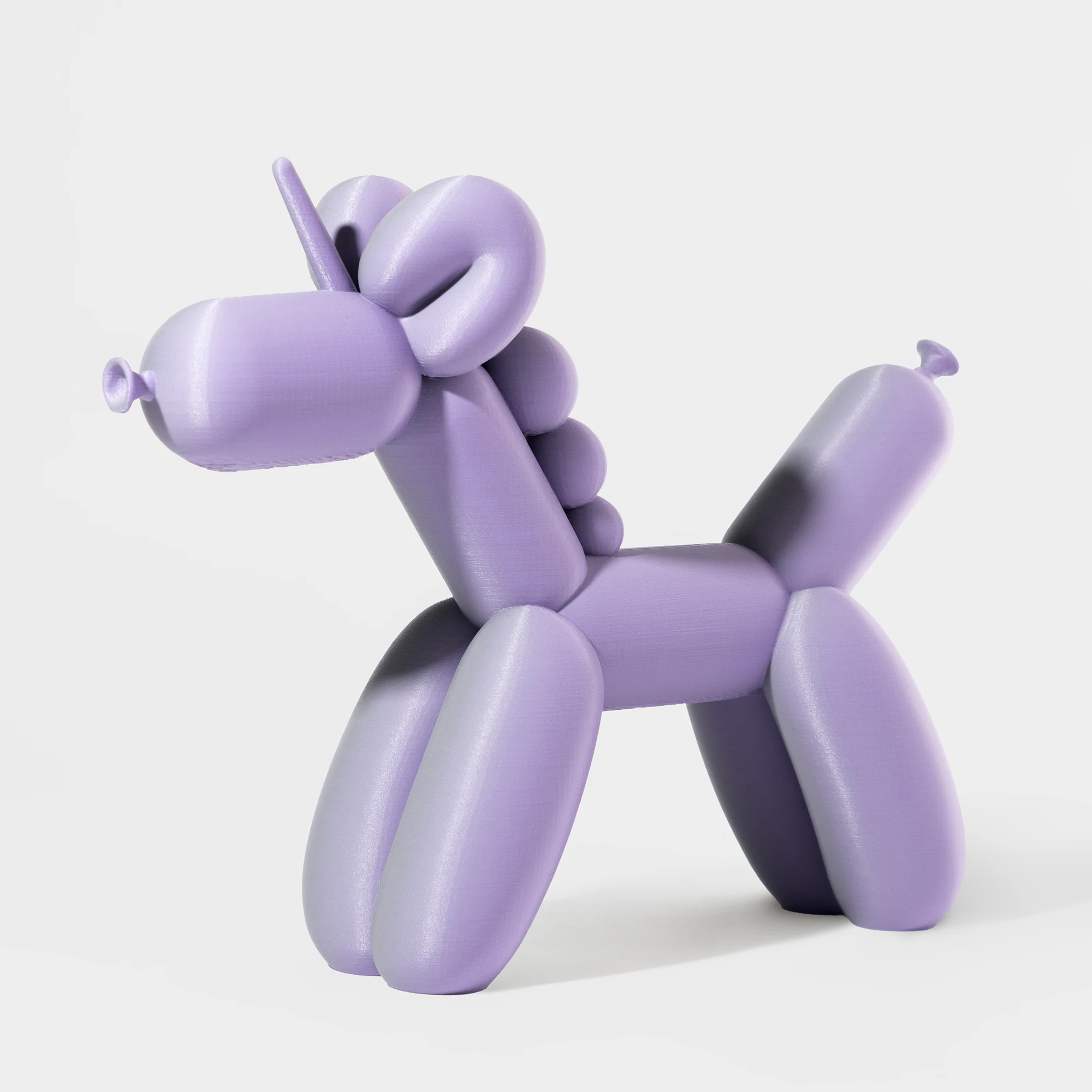 הדפסת תלת מימד של בלון בצורת חד קרן בגווני סגול ואפור