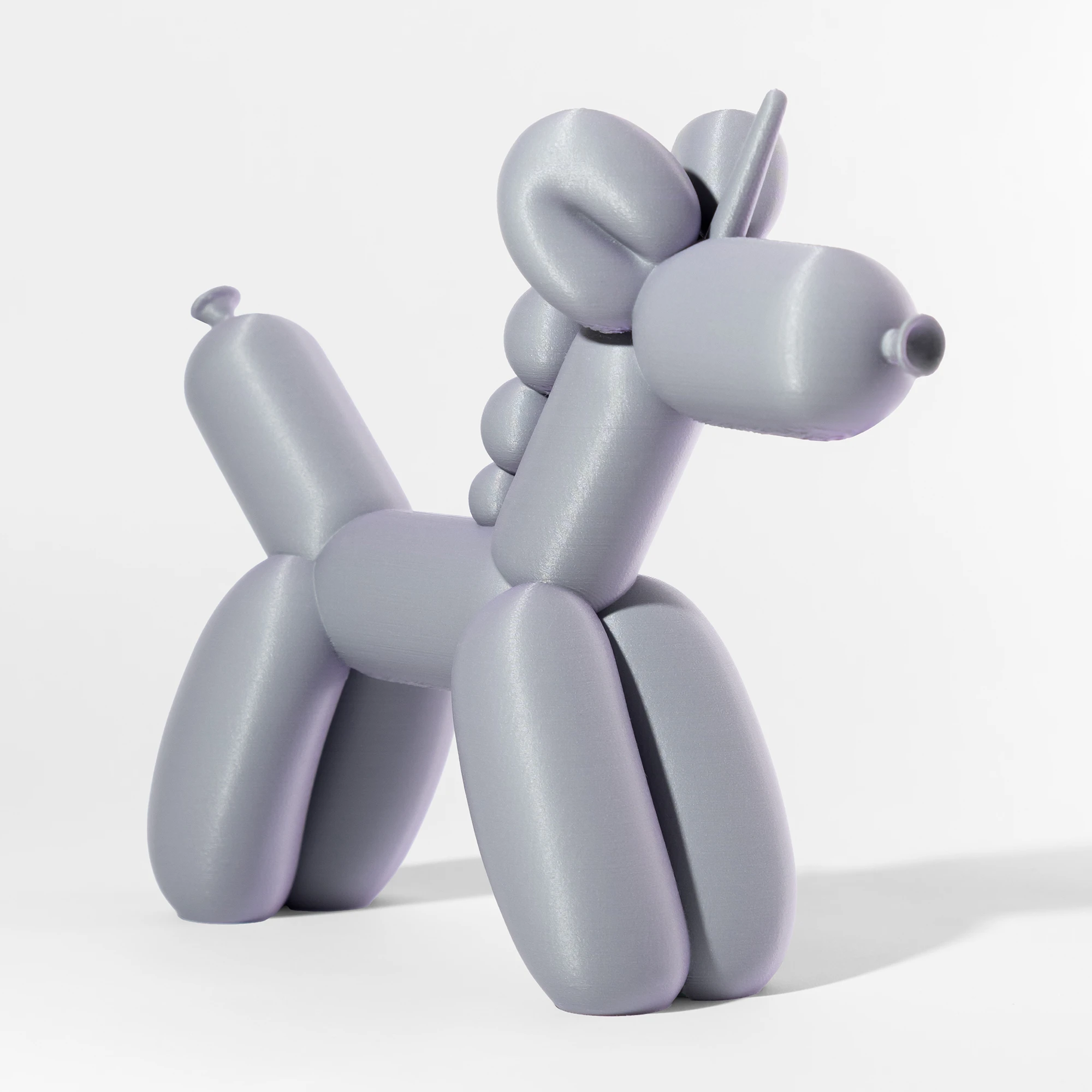 הדפסת תלת מימד של בלון בצורת חד קרן בגווני סגול ואפור