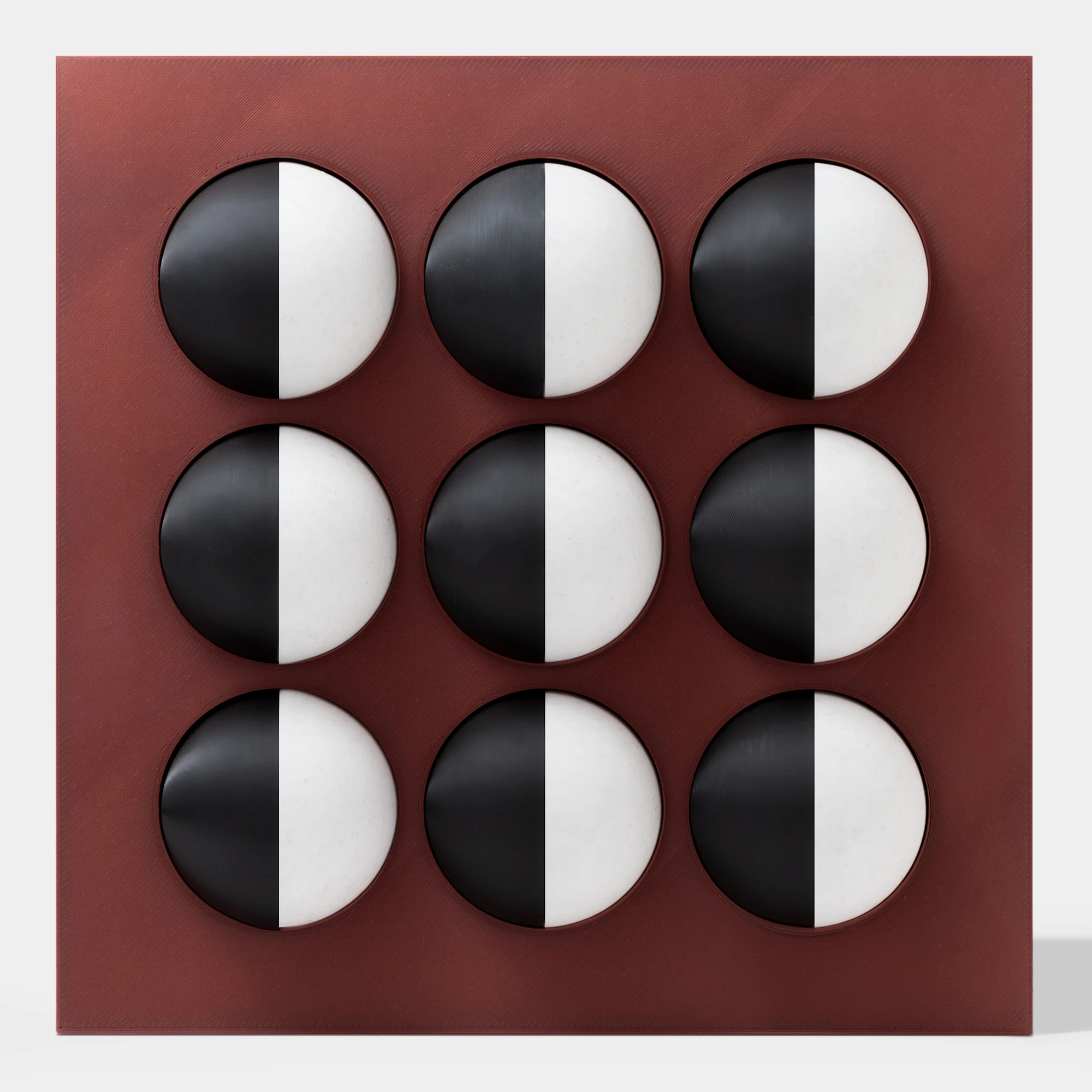 קופסה בהדפסת תלת מימד בצבע בורדו עם 9 כדורים מחולקים לצבעי שחור ולבן-שיש