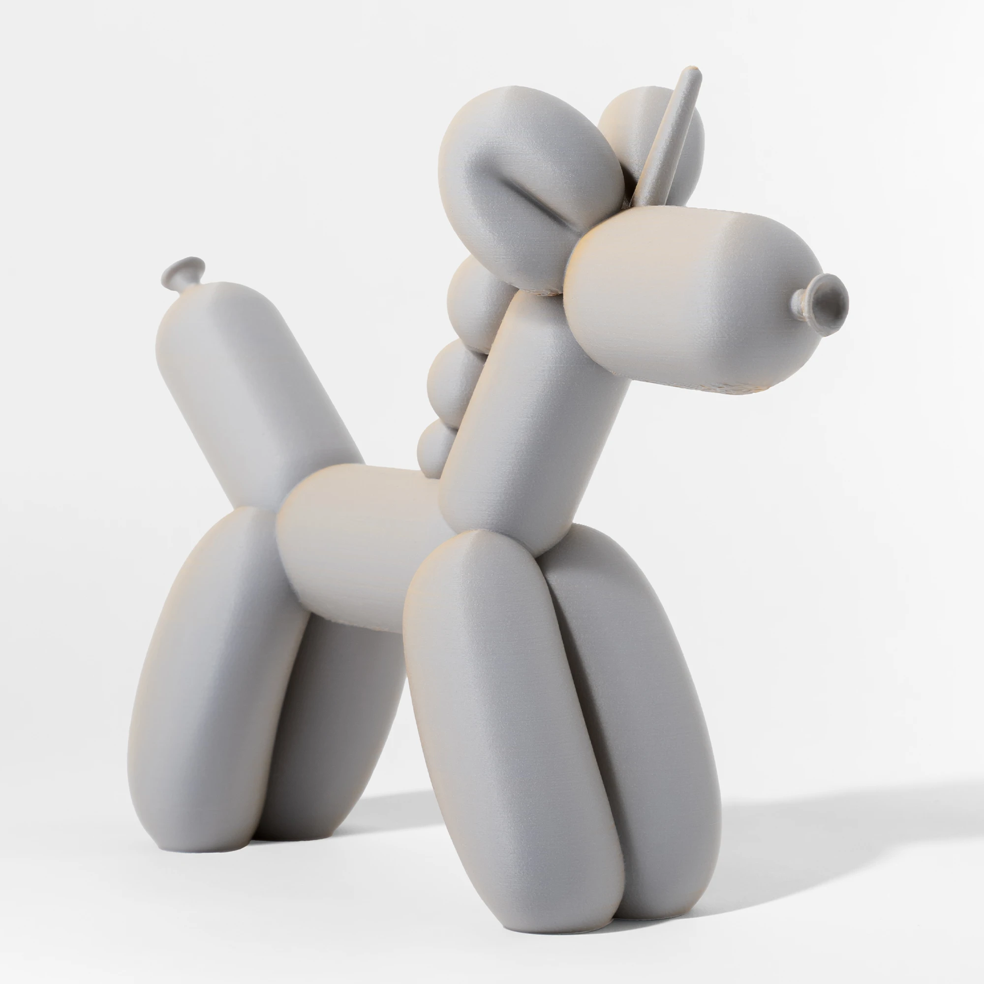 הדפסת תלת מימד של בלון בצורת חד קרן בגווני אפור-טרקוטה