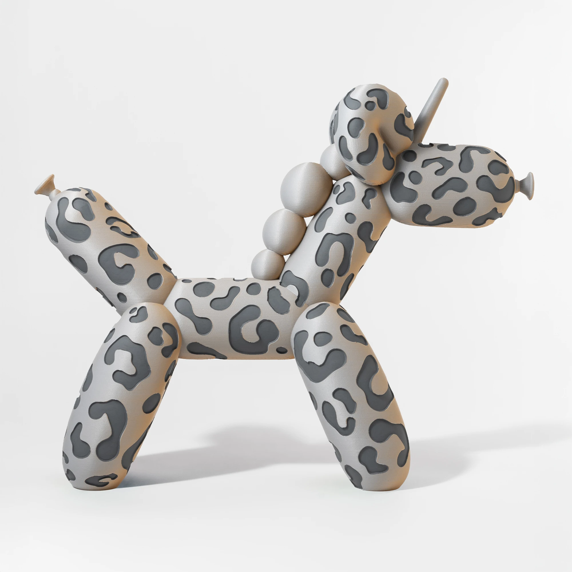 הדפסת תלת מימד של בלון בצורת חד קרן בצבע אפור וטרקוטה מנומר